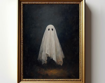 Puede incluir: Una impresión de arte mural enmarcada que muestra una figura de fantasma blanca cubierta con una sábana con dos ojos ovalados oscuros sobre un fondo oscuro y sombrío. La obra está en un marco dorado ornamentado. Aparece el texto Instant Printable Wall Art y ArtifyFrameCo.