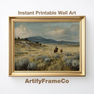 Puede incluir: Una pintura de paisaje enmarcada con dos figuras a caballo que atraviesan una llanura herbosa bajo un cielo nublado. La obra de arte está en un marco dorado adornado. El texto en la parte superior dice "Instant Printable Wall Art" y "ArtifyFrameCo" en la parte inferior.