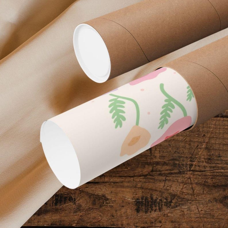 Close-up of rolled poster prints resting on a wooden surface, partially unwrapped to reveal the pastel floral pattern with soft pink, yellow, blue, and purple blooms. The visible artwork shows delicate flowers and green stems, highlighting the print material and packaging while helping buyers understand how the artwork arrives before framing or display