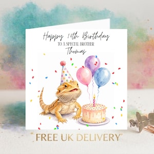 May include: A white greeting card featuring a watercolour illustration of a bearded dragon wearing a colourful polka-dot party hat. Next to it is a birthday cake with a single lit candle and three balloons. Text reads: Happy 14th Birthday TO A SPECIAL BROTHER Thomas.