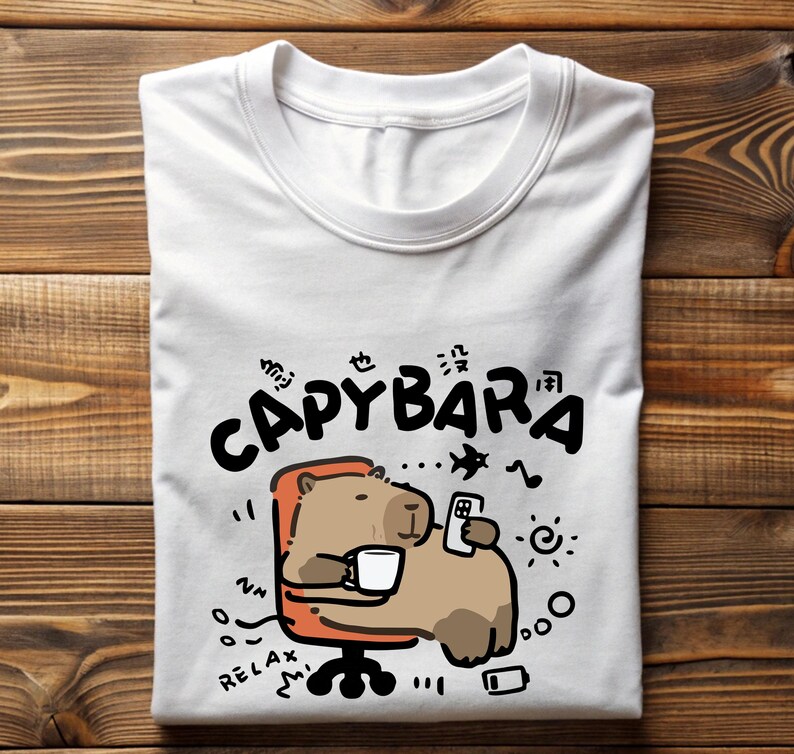 a white t - shirt with a cartoon bear holding a cell phone