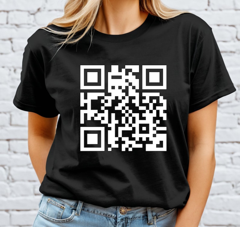 a woman wearing a black t - shirt with a qr code on it