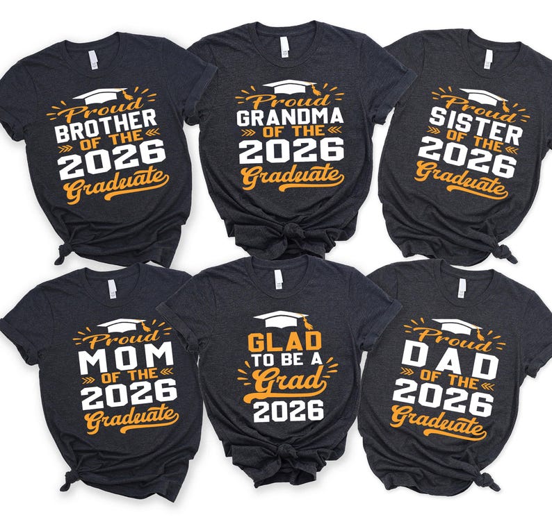 a collection of six black t-shirts with text and graphics printed on them, celebrating the graduation of the 26th of the year.