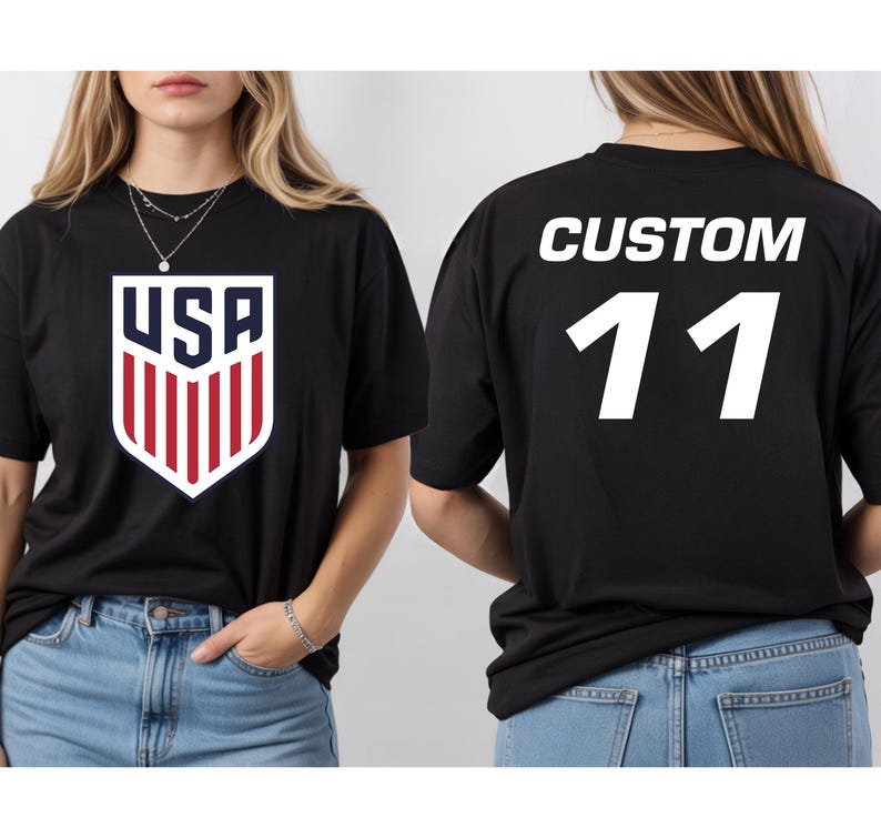 A woman wearing a black t-shirt with the USA logo and the number 11 on the back.