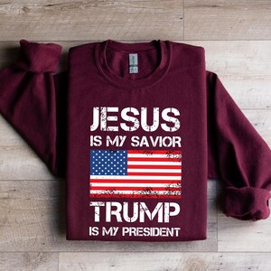 a t - shirt that says jesus is my savor trump is my president