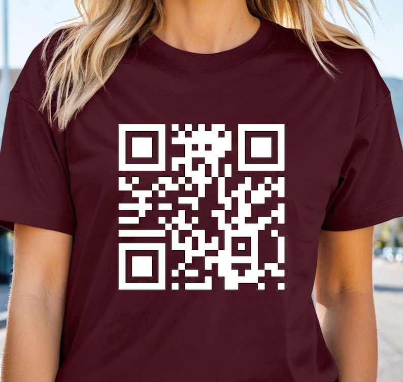 a woman wearing a t - shirt with a qr code on it