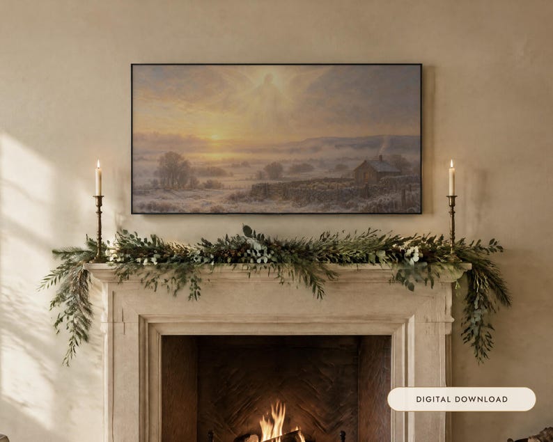 May include: A rectangular landscape painting featuring a snowy countryside scene with a small house, stone walls, and a glowing sunrise, displayed above a fireplace mantel decorated with a green pine garland and two tall brass candlesticks.