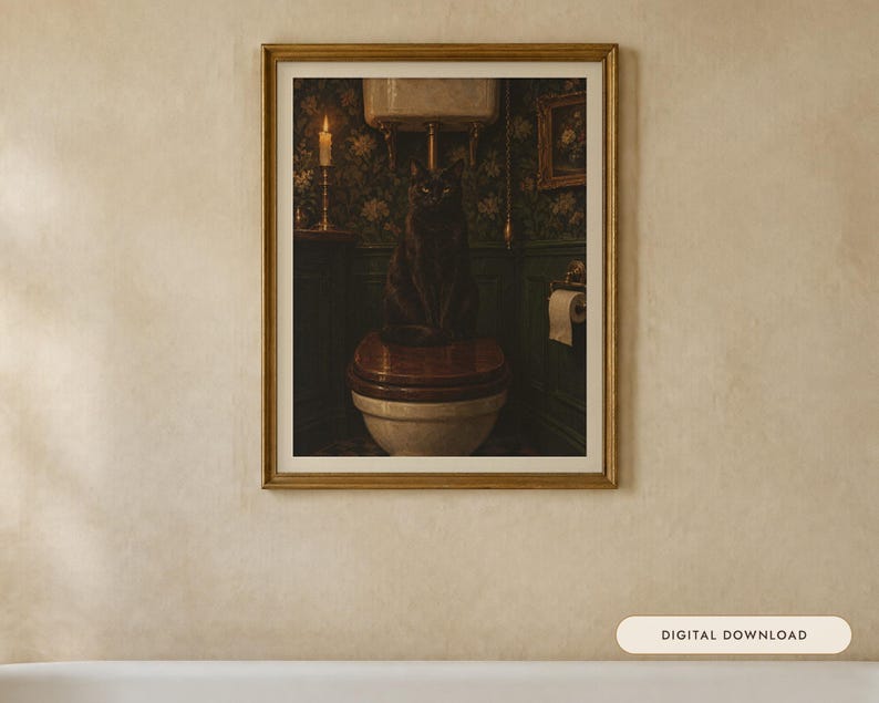 May include: A framed wall art print featuring a dark, moody bathroom scene with a black cat sitting on a wooden toilet seat. The room has dark green floral wallpaper, a lit candle on a stand, and a roll of toilet paper on a holder.