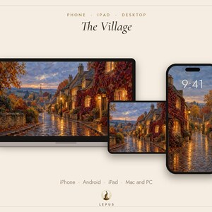 May include: A digital display set featuring a laptop, tablet, and smartphone showing a painting titled The Village. The artwork depicts a cobblestone street lined with stone cottages covered in autumn vines at dusk, with warm glowing windows.