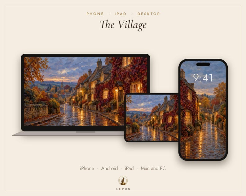 May include: A digital display set featuring a laptop, tablet, and smartphone showing a painting titled The Village. The artwork depicts a cobblestone street lined with stone cottages covered in autumn vines at dusk, with warm glowing windows.