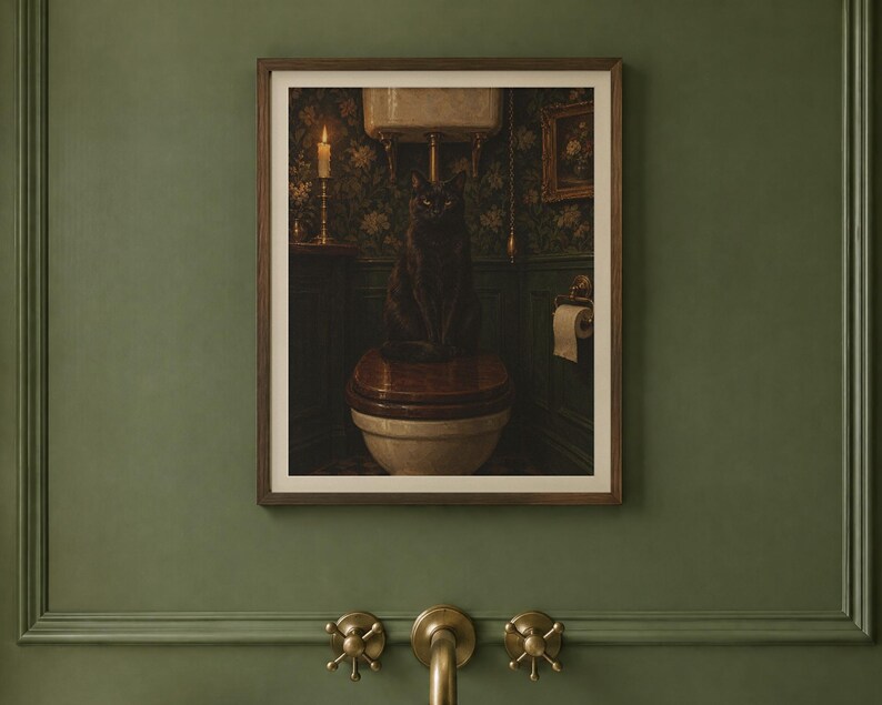 May include: A framed wall art print featuring a black cat sitting on a toilet in a dimly lit bathroom with dark floral wallpaper, a lit candle on a shelf, and a roll of toilet paper hanging on the wall next to the toilet fixture.