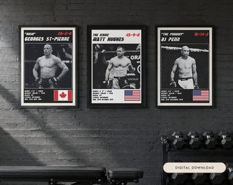 May include: Three framed posters featuring black and white photographs of MMA fighters Georges St-Pierre, Matt Hughes, and BJ Penn. Each print includes the fighter's name, nickname, record, height, weight, reach, stance, birth date, and national flag.