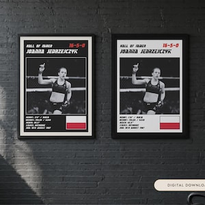 May include: Two identical framed posters featuring a black and white photograph of Joanna Jedrzejczyk in a fighting stance. The text includes Hall of Famer, 16-5-0, her name, height 5'6", weight 115lbs, reach 65.5", stance orthodox, DOB 18th August 1987, and a Polish flag.