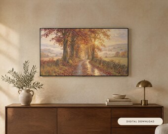 Può includere: Un dipinto paesaggistico rettangolare che raffigura una strada di campagna alberata in autunno con luce solare dorata, fogliame arancione e un muro in pietra. L'opera è in una cornice nera sottile e include il testo Digital Download.
