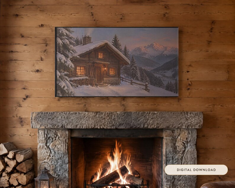 May include: A rectangular wall art print featuring a snowy mountain landscape with a wooden cabin, pine trees, and glowing windows. The artwork is displayed above a stone fireplace with a burning fire and a stack of firewood nearby.