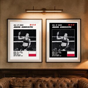 May include: Two framed posters featuring Joanna Jedrzejczyk in a fighting stance. Each print displays her name, record 16-5-0, Hall of Famer status, and stats including height 5'6", weight 115 lbs, reach 65.5", stance orthodox, DOB 18th August 1987, and the Polish flag.
