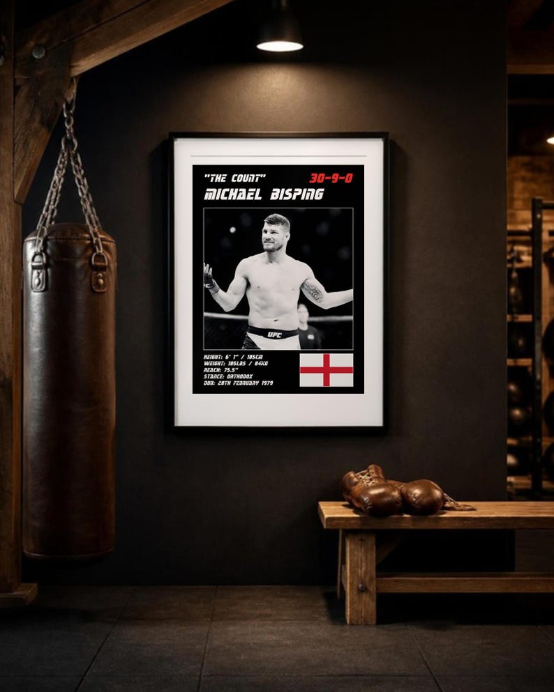 May include: A framed poster featuring a black and white photograph of Michael Bisping with the text "The Count" 30-9-0, Michael Bisping, height 6'1" / 185cm, weight 185lbs / 84kg, reach 75.5", stance orthodox, DOB 28th February 1979, and an English flag.