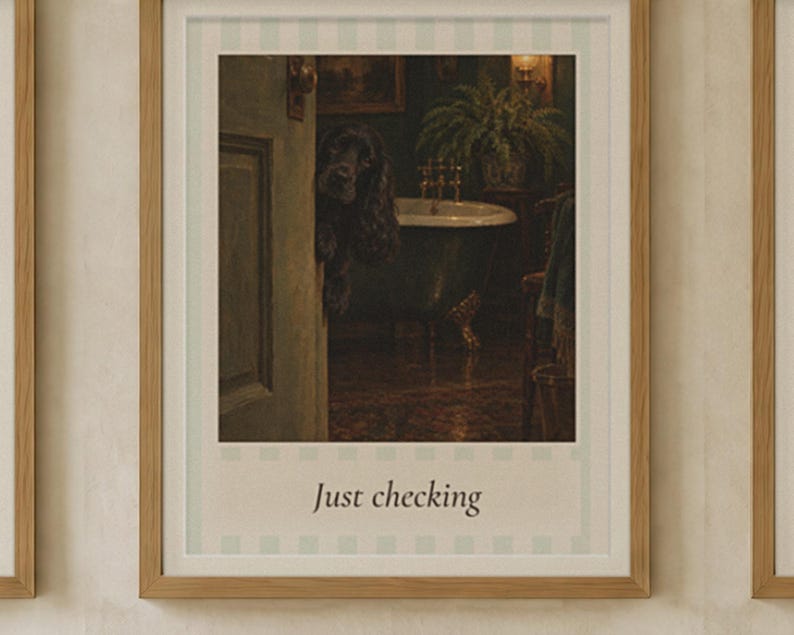 May include: A framed wall art print featuring a dark-furred dog peeking through a doorway into a bathroom with a clawfoot tub and a potted plant. The print has a light blue and white striped border and the text Just checking at the bottom.