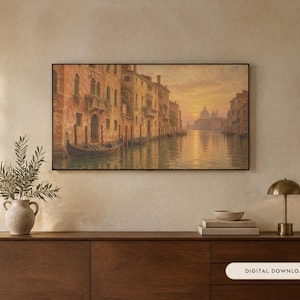 May include: A rectangular framed wall art print depicting a Venetian canal scene at sunset with warm orange and golden hues, featuring historic buildings and a gondola on the water. The text "DIGITAL DOWNLOAD" is visible in the lower right corner.
