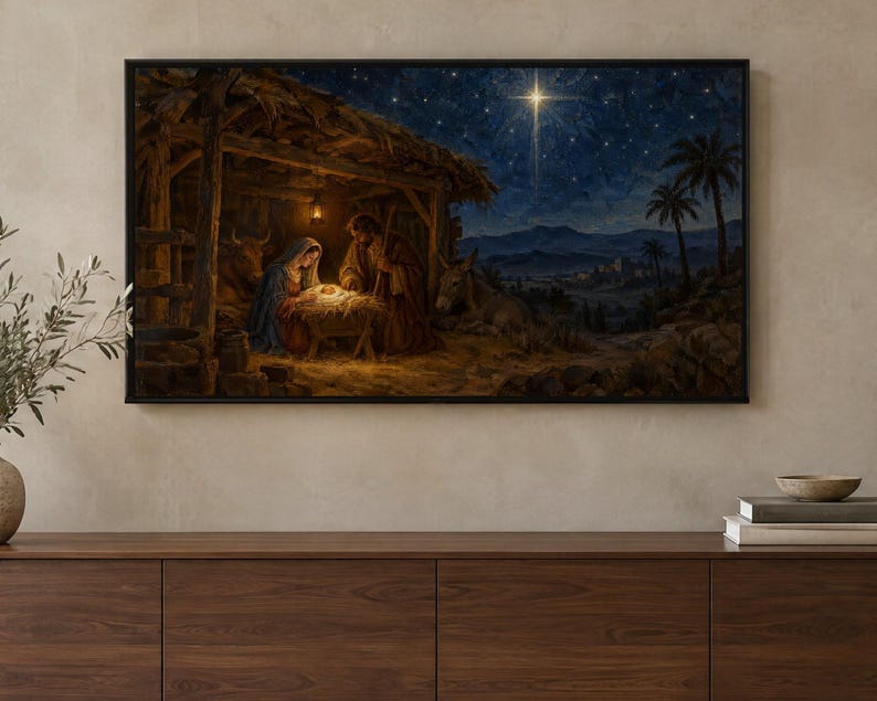 May include: A rectangular wall art print depicting a nativity scene inside a wooden stable at night. The scene features figures gathered around a glowing manger under a dark blue starry sky with a bright star shining above a distant landscape.