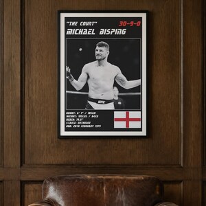 May include: A framed poster featuring a black and white photograph of Michael Bisping in a fighting stance. The text includes his nickname The Count, record 30-9-0, height 6' 1", weight 185 lbs, reach 75.5", stance orthodox, and birth date 28th February 1979.