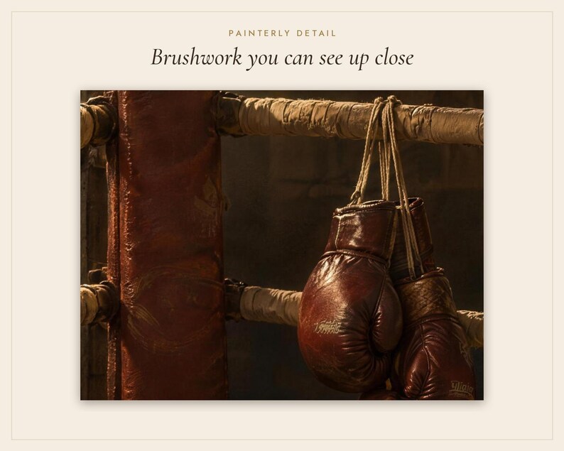 Pode incluir: Um par de luvas de boxe de couro castanho escuro penduradas num poste de ringue almofadado. O texto PAINTERLY DETAIL e Brushwork you can see up close &eacute; vis&iacute;vel no topo da imagem, contra um fundo quente e pouco iluminado.