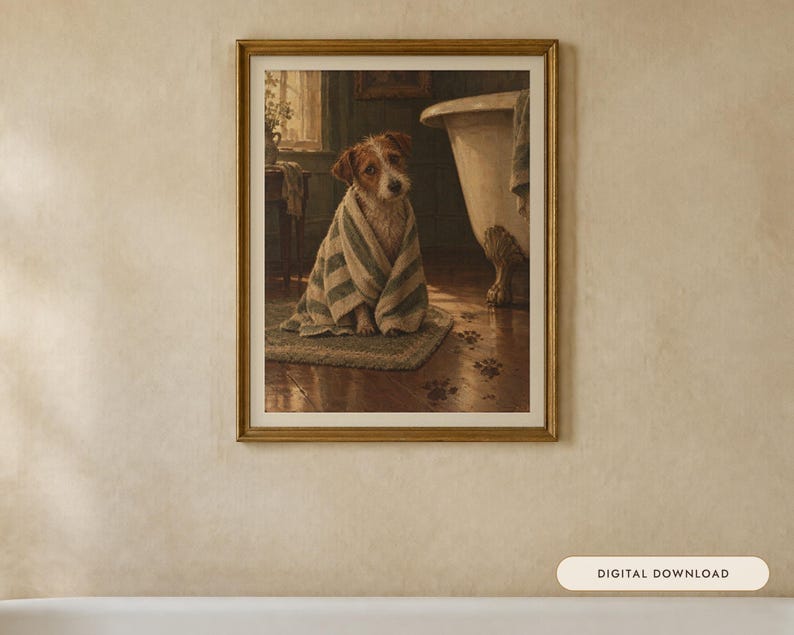 May include: A framed wall art print depicting a small brown and white dog wrapped in a striped towel, sitting on a bath mat in a bathroom. A claw-foot bathtub is visible to the right, and dark muddy paw prints lead across the wooden floor.