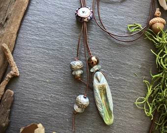 Owl and evil eye lariat bollo necklace with handmade lampwork bead ceramic focal on adjustable leather cord talisman amulet totem jewelry