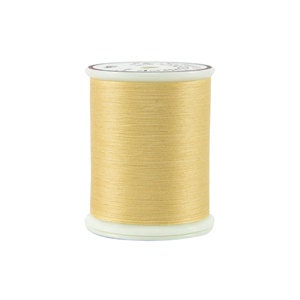 May include: A spool of pale yellow thread.