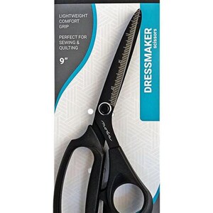 May include: Black dressmaker scissors on a white and blue package. The scissors are 9 inches long with a ruler printed on the blade. The package text includes "Lightweight Comfort Grip" and "Perfect for Sewing & Quilting."