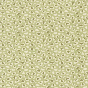 May include: A close-up of a fabric with a repeating pattern of small, irregular shapes in shades of green, off-white, and olive. The design resembles a leopard print, creating a textured and organic appearance. The fabric has a subtle, woven texture.