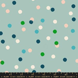 May include: A fabric featuring a light teal backdrop adorned with polka dots in white, pink, teal, green, and navy blue. A ruler and the text "RUBY STAR SOCIETY" are at the bottom.