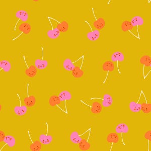 May include: A repeating pattern of cartoon cherries in shades of pink and orange with smiling faces on a mustard yellow background. The cherries have white stems and are arranged in pairs.