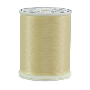 May include: A spool of cream-colored thread with a blue and white label that reads "Superior Quality 100% Cotton Embroidery Floss".