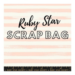 May include: A pink and white striped fabric with the text "Ruby Star SCRAP BAG" in black. The fabric has a textured, brushstroke-like pattern.