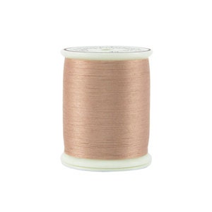 May include: A spool of light brown thread, wound on a white plastic bobbin.