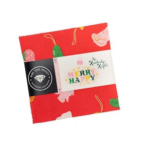 May include: A pack of red fabric squares, each 12.7 cm, featuring a playful design of cartoon fruits and vegetables. The label reads "Merry Happy" and "Ruby Star Society". The pack contains 42 pieces.