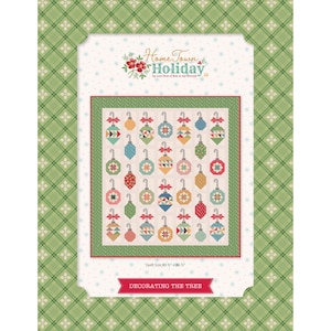 May include: A quilt pattern titled "Home Town Holiday" featuring a design of colorful Christmas ornaments. The quilt size is 80.5" x 86.5". The text "Decorating the Tree" is displayed at the bottom. The background is a green plaid pattern.