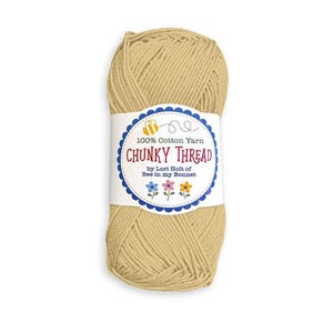 May include: A ball of tan-coloured chunky cotton thread. The label reads "100% Cotton Yarn CHUNKY THREAD" with a bee and flower graphic. The thread is by Lori Holt of Bee in my Bonnet. Suitable for various craft projects.