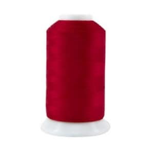 May include: A spool of red thread for sewing or embroidery.