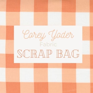 May include: A white and peach gingham fabric scrap bag with the text "Corey Yoder Fabric SCRAP BAG" on a white label.