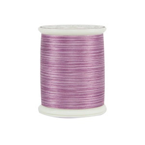 May include: A spool of light purple thread with a white label.