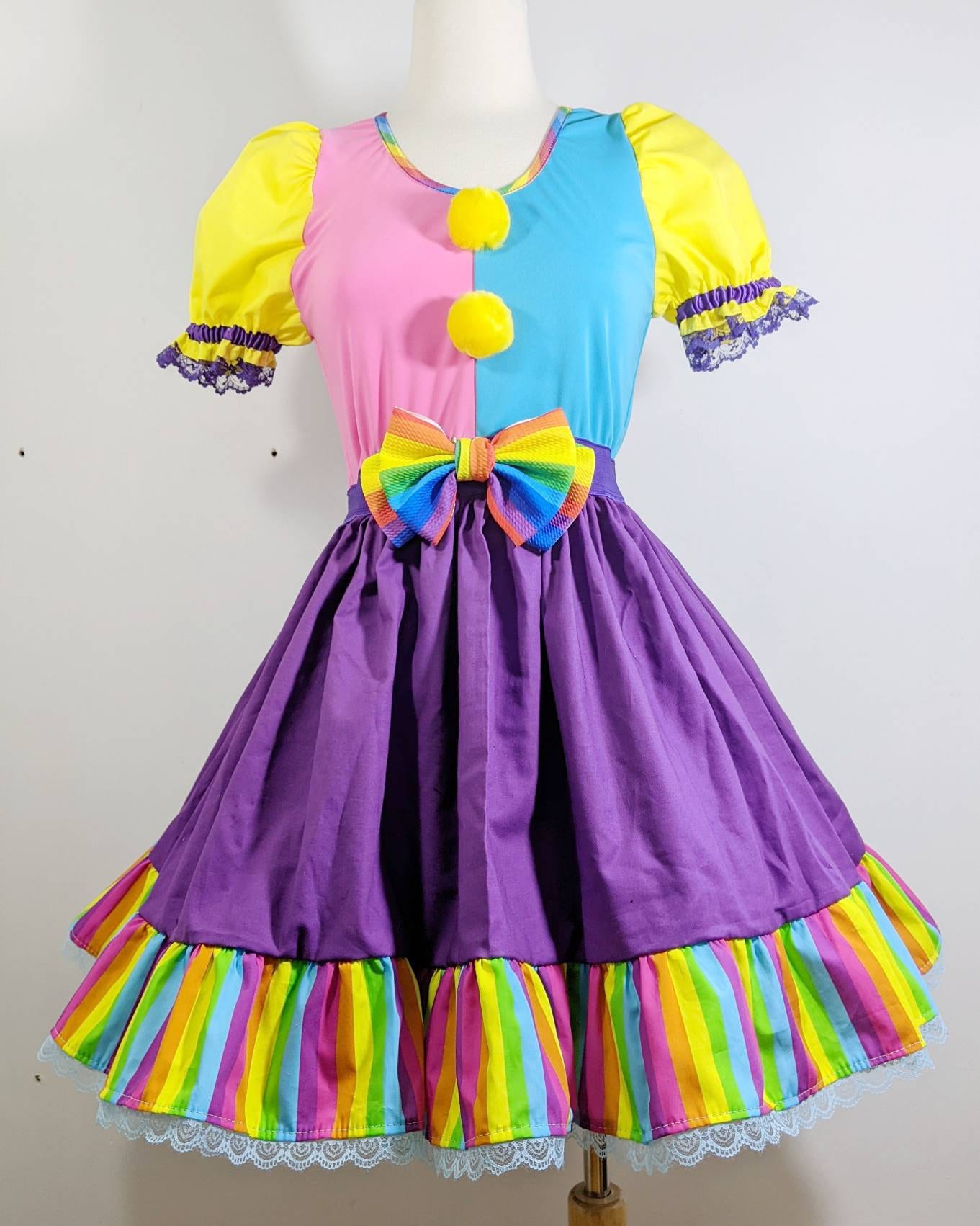 Female harlequin, costume dress, suspenders, pom pom buttons, stripes