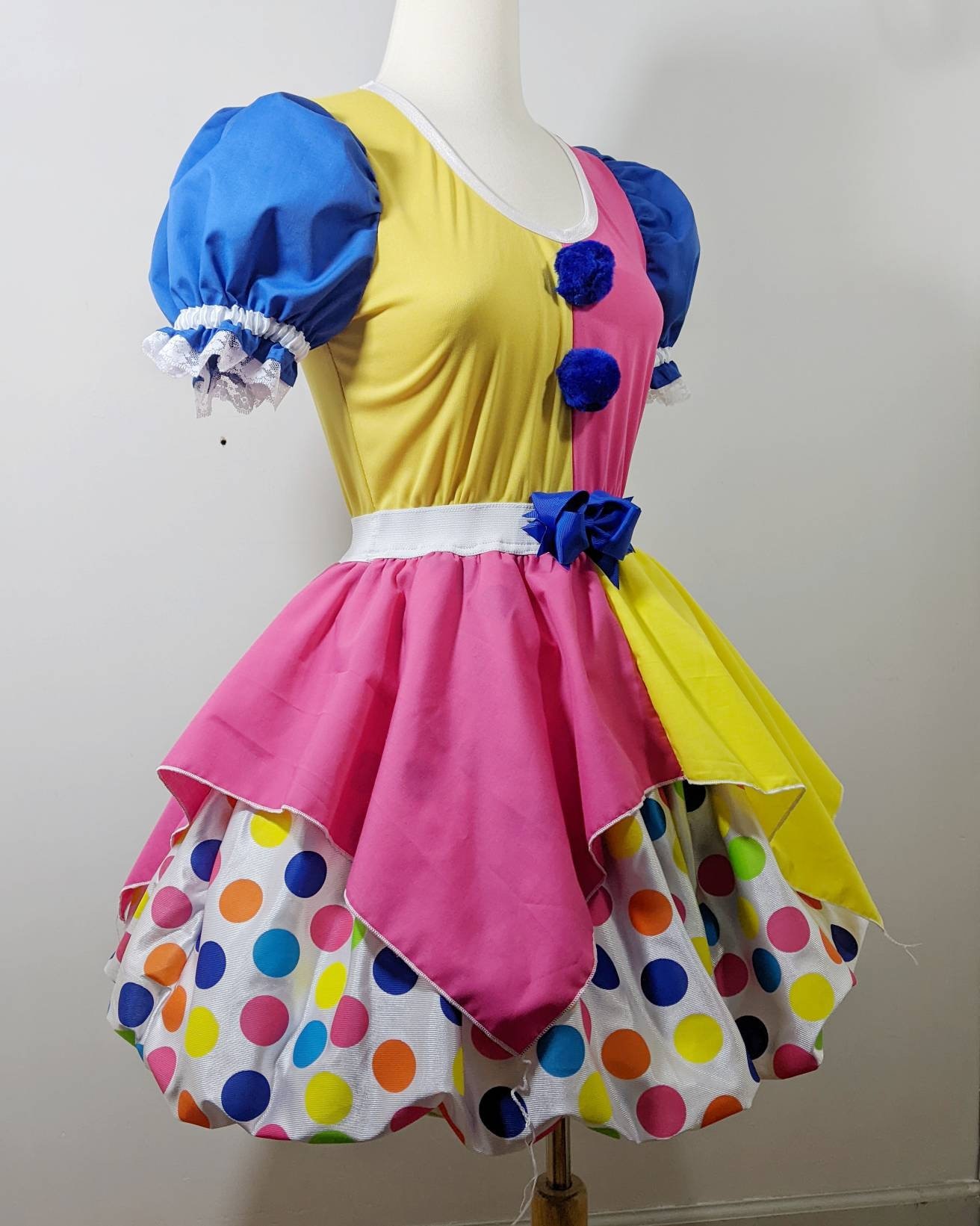 A woman clown, all in primary colors, cute clown ma