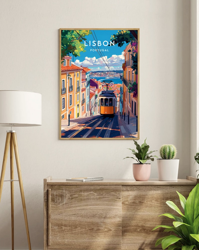 May include: A colorful illustration of a yellow tram traveling up a hill in Lisbon, Portugal. The tram is surrounded by colorful buildings and lush greenery. The text "LISBON PORTUGAL" is displayed at the top of the image.