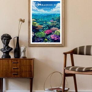 May include: A framed poster with a colorful illustration of the Great Barrier Reef in Australia. The poster features a variety of coral and fish in a vibrant underwater scene.
