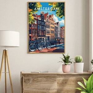 May include: A colorful illustration of Amsterdam, Netherlands, with a view of canal houses and bicycles. The text "AMSTERDAM" and "NETHERLANDS" is displayed in the top center of the image.