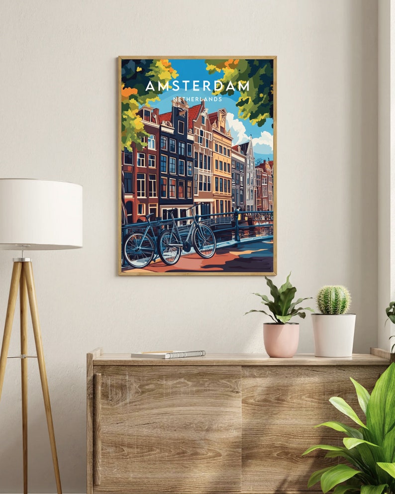 May include: A colorful illustration of Amsterdam, Netherlands, with a view of canal houses and bicycles. The text "AMSTERDAM" and "NETHERLANDS" is displayed in the top center of the image.