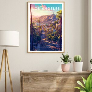 May include: A vintage travel poster with a sunset view of Los Angeles, California. The poster features a road leading up a hill with palm trees lining the sides. The text "LOS ANGELES" and "UNITED STATES" is printed in white at the top of the poster.