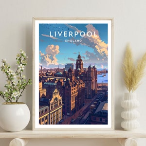 May include: A framed art print featuring a stylized illustration of Liverpool, England. The artwork depicts a cityscape with detailed buildings under a blue sky with clouds. The word "LIVERPOOL" is at the top, with "ENGLAND" below it.